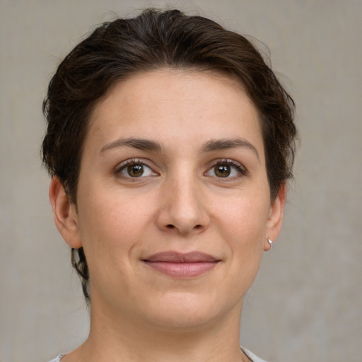 Joyful white young-adult female with medium  brown hair and brown eyes