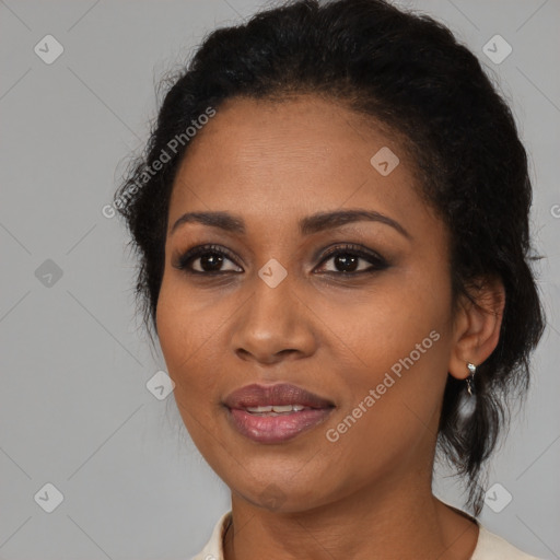 Joyful black young-adult female with medium  black hair and brown eyes