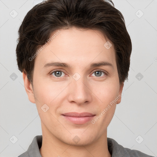 Joyful white young-adult female with short  brown hair and grey eyes