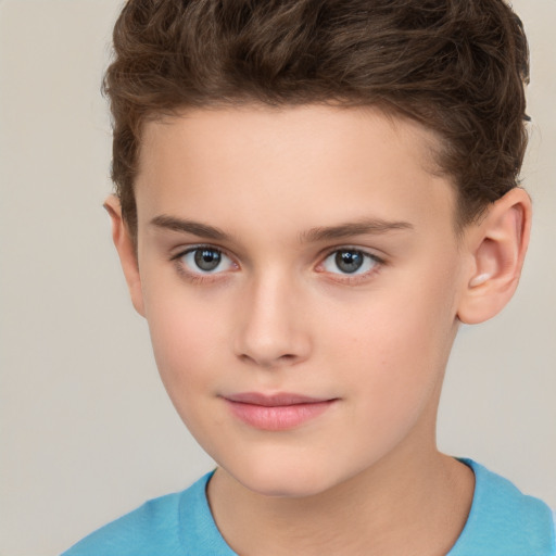 Joyful white child male with short  brown hair and brown eyes