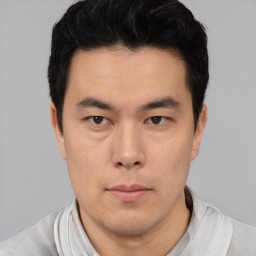 Neutral asian young-adult male with short  black hair and brown eyes