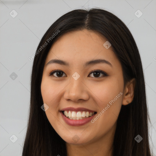 Joyful latino young-adult female with long  brown hair and brown eyes