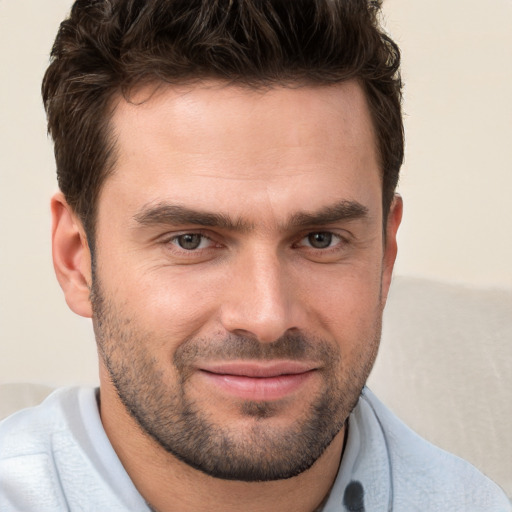 Joyful white young-adult male with short  brown hair and brown eyes