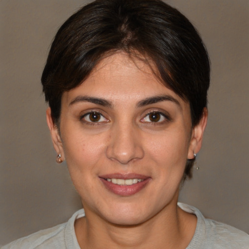 Joyful white young-adult female with short  brown hair and brown eyes