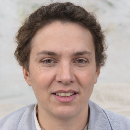 Joyful white adult female with short  brown hair and grey eyes