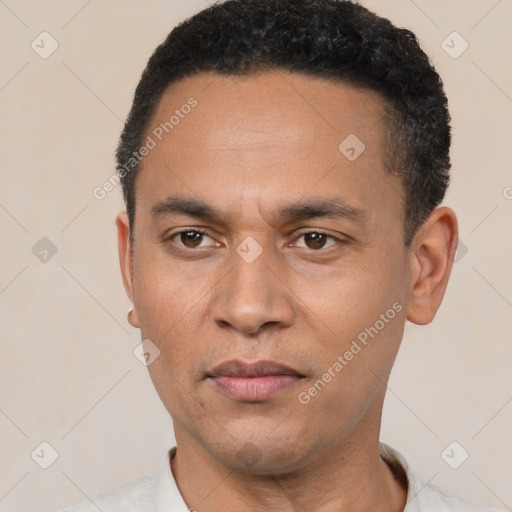 Neutral latino young-adult male with short  black hair and brown eyes