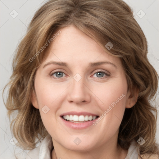 Joyful white young-adult female with medium  brown hair and blue eyes