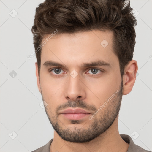 Neutral white young-adult male with short  brown hair and brown eyes