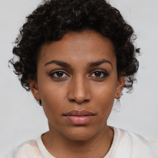 Neutral black young-adult female with short  brown hair and brown eyes