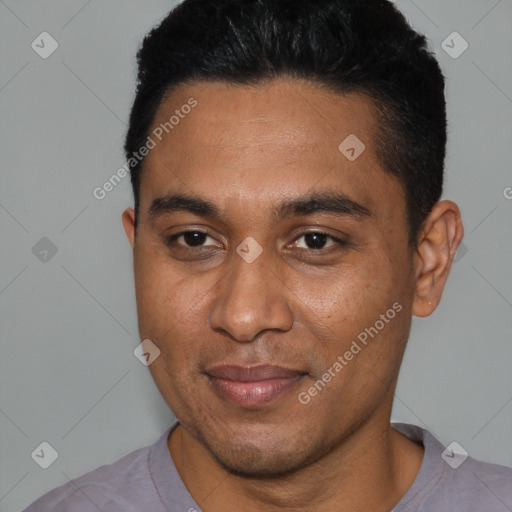 Joyful black young-adult male with short  black hair and brown eyes