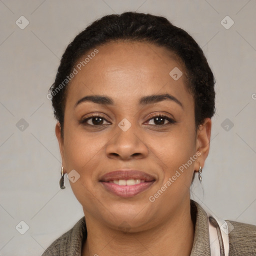 Joyful latino young-adult female with short  black hair and brown eyes