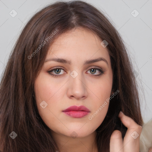 Neutral white young-adult female with long  brown hair and brown eyes