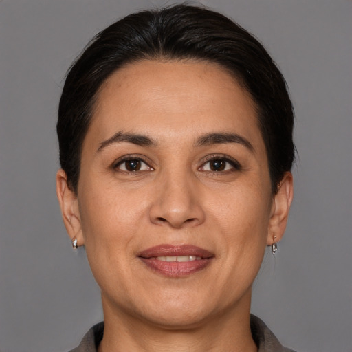 Joyful white adult female with short  brown hair and brown eyes