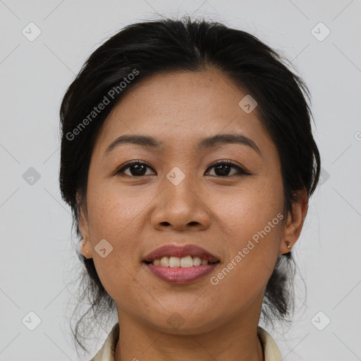 Joyful asian adult female with medium  brown hair and brown eyes