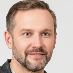 Joyful white adult male with short  brown hair and grey eyes