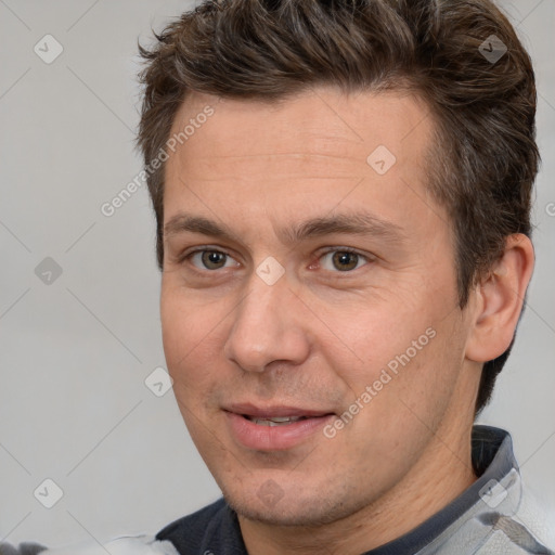 Joyful white adult male with short  brown hair and brown eyes