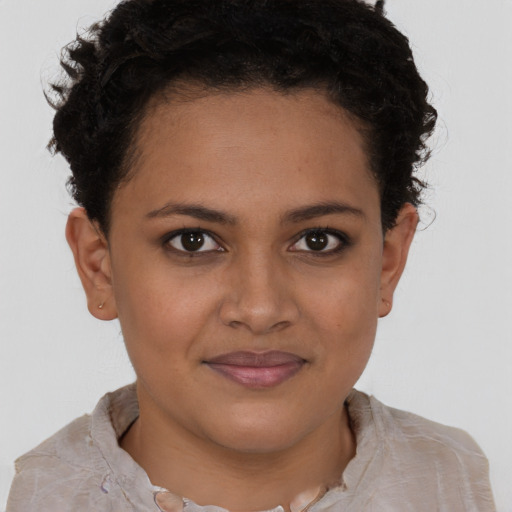 Joyful latino young-adult female with short  brown hair and brown eyes