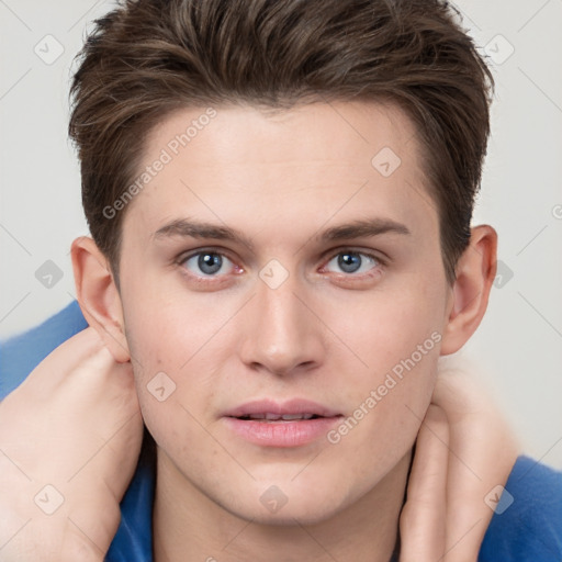 Neutral white young-adult male with short  brown hair and grey eyes