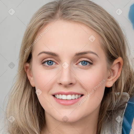 Joyful white young-adult female with long  brown hair and blue eyes