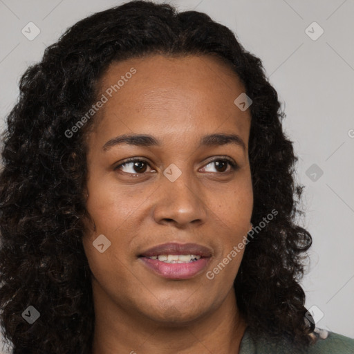 Joyful black young-adult female with long  brown hair and brown eyes