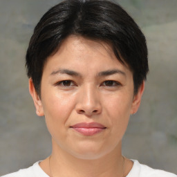 Joyful white adult female with short  brown hair and brown eyes