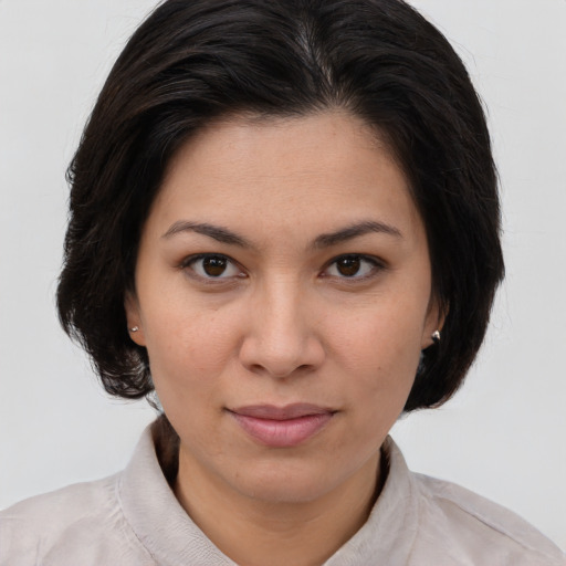 Joyful white young-adult female with medium  brown hair and brown eyes