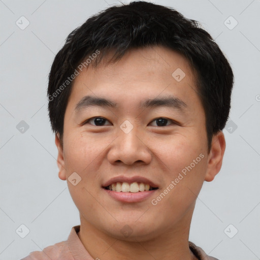 Joyful asian young-adult male with short  black hair and brown eyes