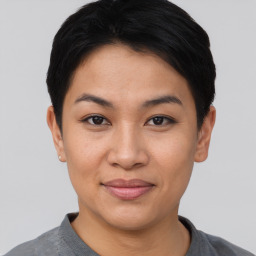 Joyful asian young-adult female with short  black hair and brown eyes