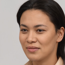 Joyful asian young-adult female with long  brown hair and brown eyes