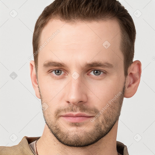 Neutral white young-adult male with short  brown hair and grey eyes