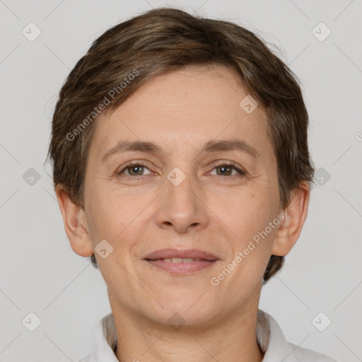 Joyful white adult female with short  brown hair and brown eyes