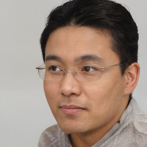 Neutral asian young-adult male with short  brown hair and brown eyes