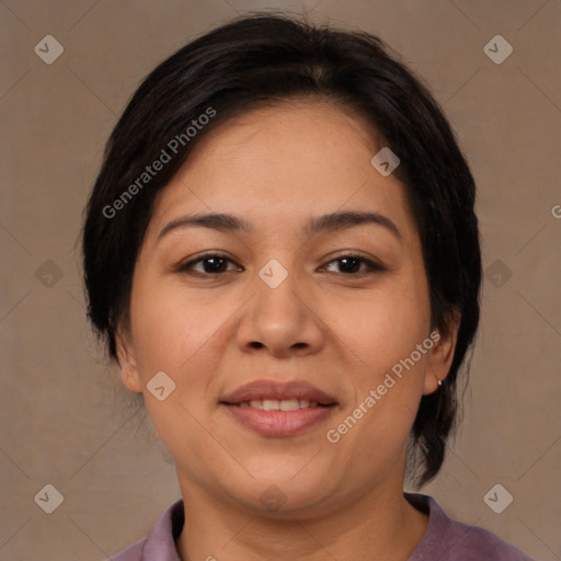 Joyful asian adult female with medium  brown hair and brown eyes