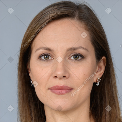 Joyful white adult female with long  brown hair and brown eyes