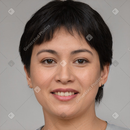 Joyful asian young-adult female with short  brown hair and brown eyes