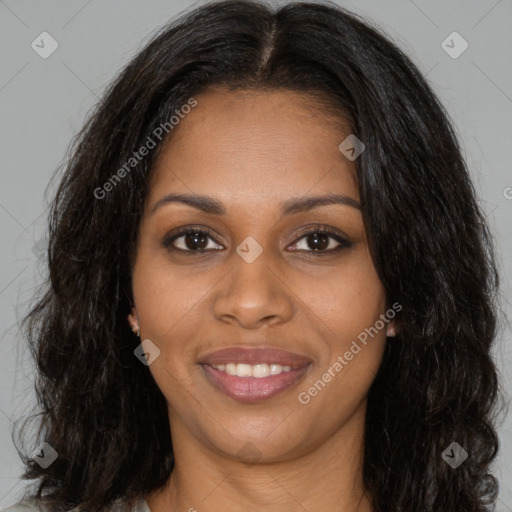 Joyful black young-adult female with long  brown hair and brown eyes