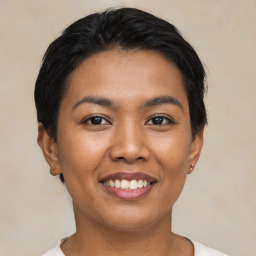 Joyful asian young-adult female with short  black hair and brown eyes