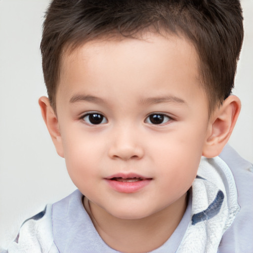 Joyful white child male with short  brown hair and brown eyes