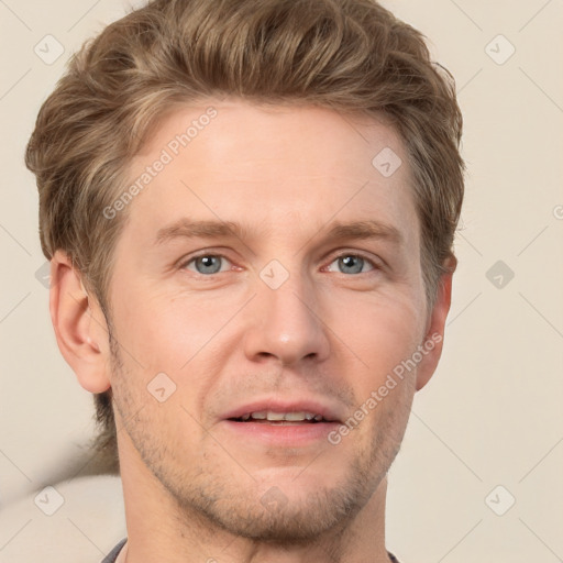 Joyful white adult male with short  brown hair and grey eyes