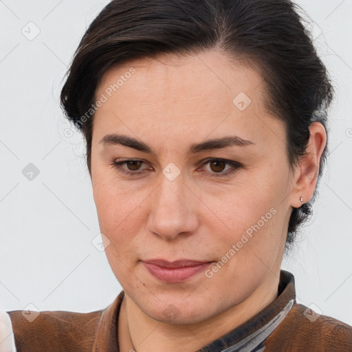 Joyful white adult female with short  brown hair and brown eyes