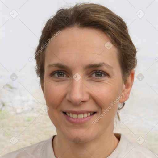 Joyful white adult female with short  brown hair and brown eyes