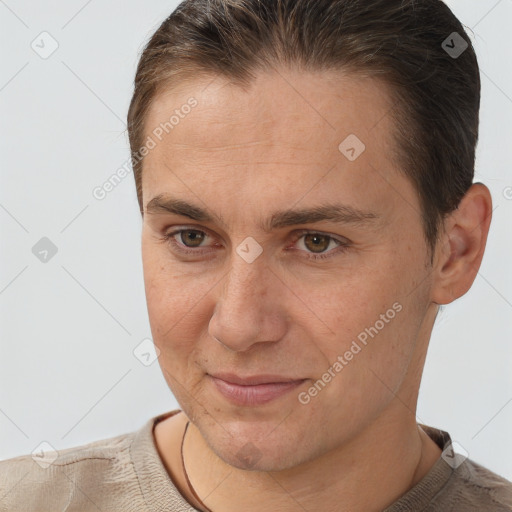 Joyful white adult male with short  brown hair and brown eyes