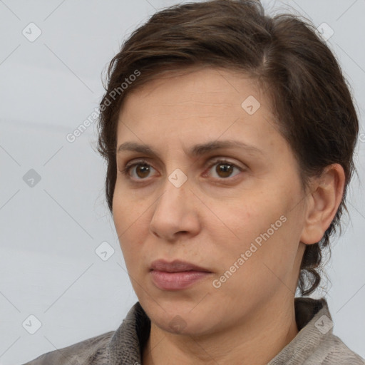 Joyful white adult female with short  brown hair and brown eyes