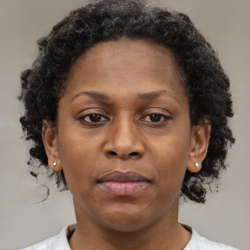 Neutral black adult female with short  brown hair and brown eyes