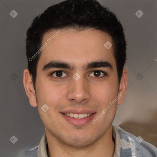 Joyful latino young-adult male with short  brown hair and brown eyes