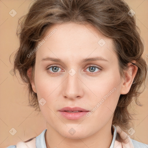 Joyful white young-adult female with medium  brown hair and blue eyes