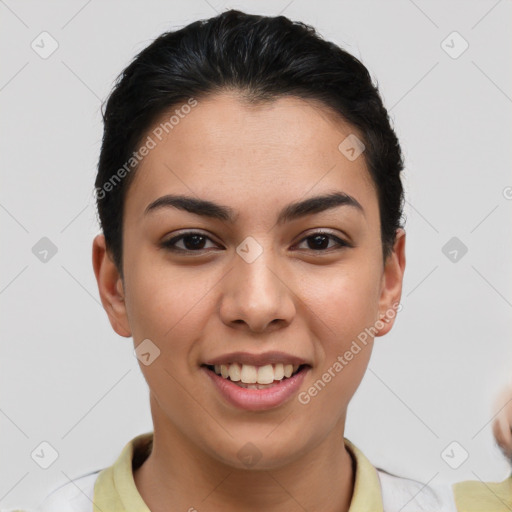 Joyful latino young-adult female with short  brown hair and brown eyes