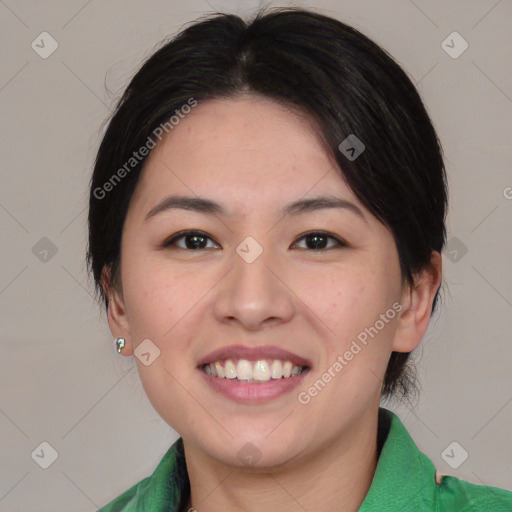 Joyful asian young-adult female with medium  black hair and brown eyes