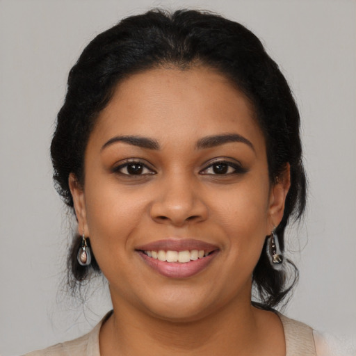Joyful latino young-adult female with medium  black hair and brown eyes