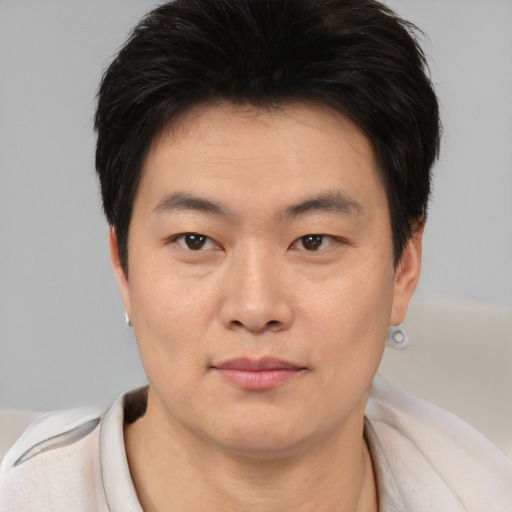 Neutral asian young-adult male with short  brown hair and brown eyes